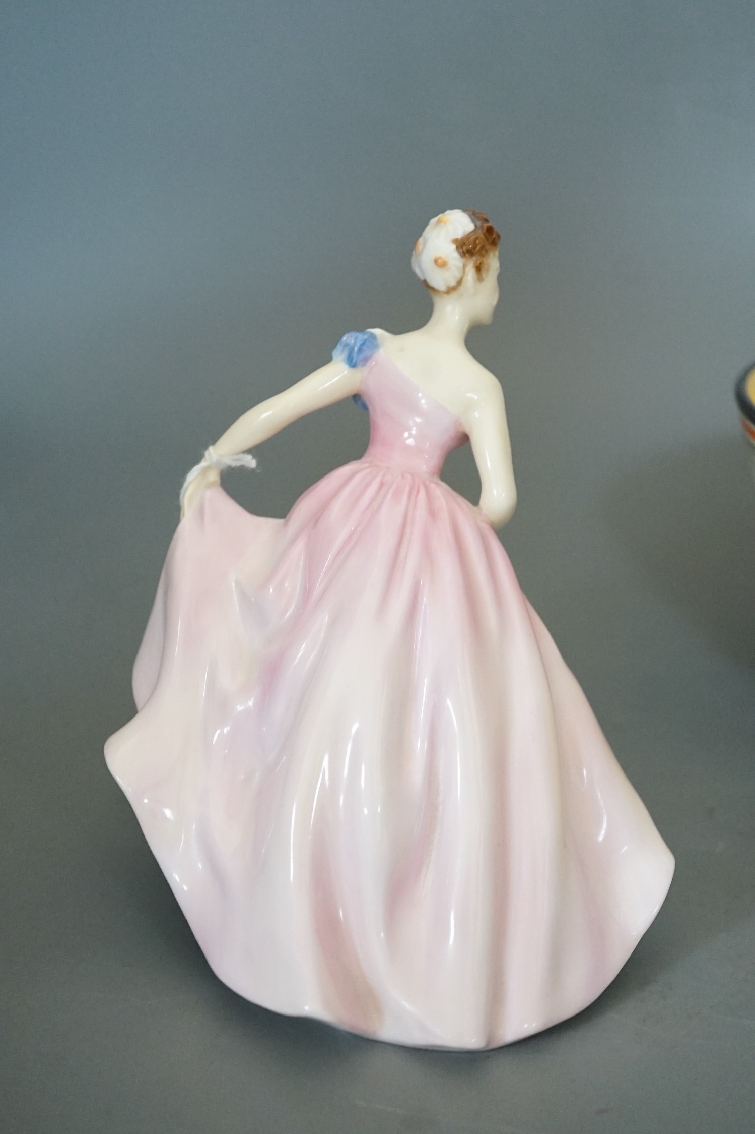 A Clarice Cliff bowl, 22cm and Doulton figure 'Invitation'